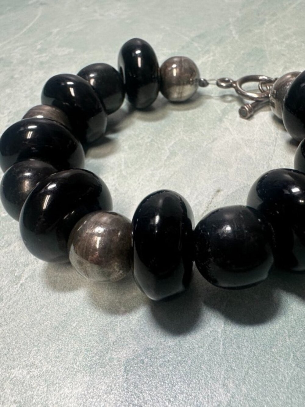 Vintage chunky black plastic beads with silver ball spacers